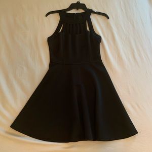 Short, sleeveless black dress with cutouts, size 3